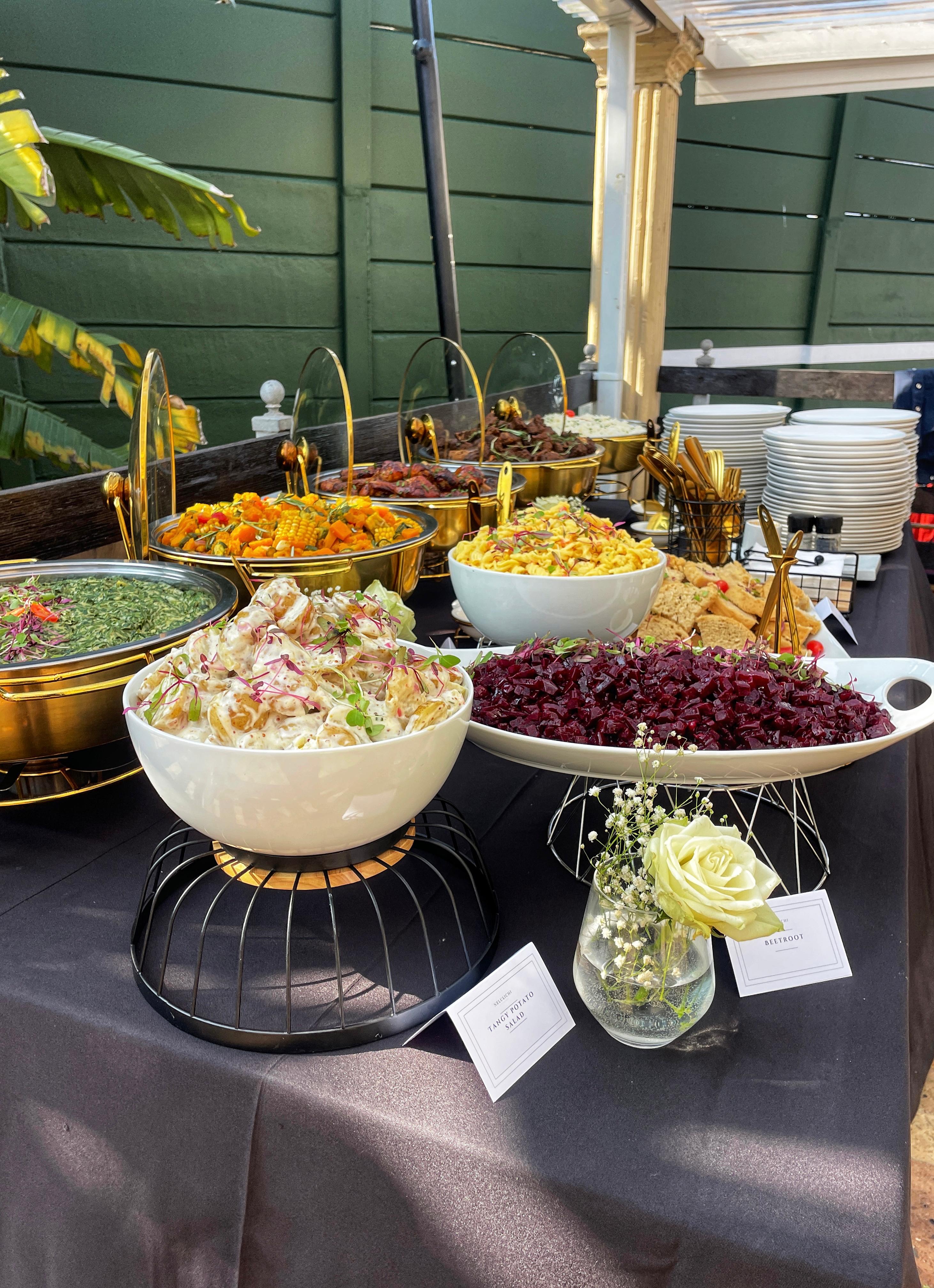 Professional buffet setup with multiple gourmet food stations